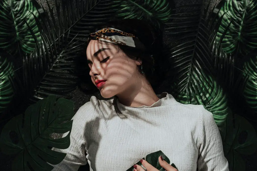 How To Sleep Better: Discover The Secrets Of A Good Night's Sleep 3 woman sleeping under the leaves during daytime