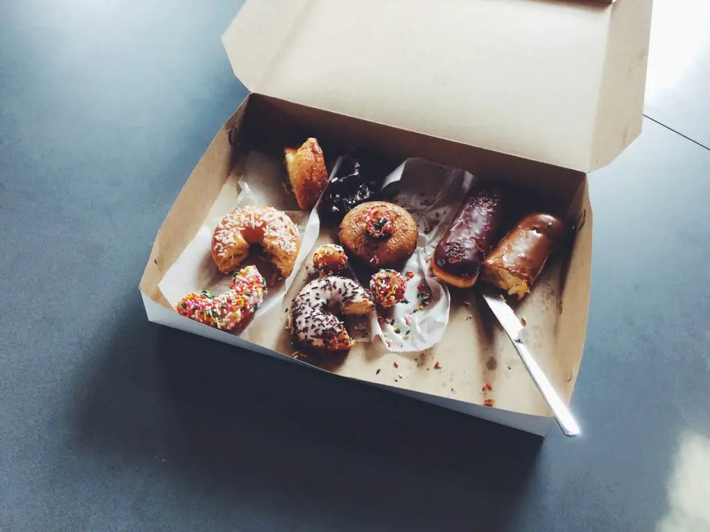 7 Tips On How To Sleep Better With An Empty Stomach 2 doughnuts on box junk food sleep