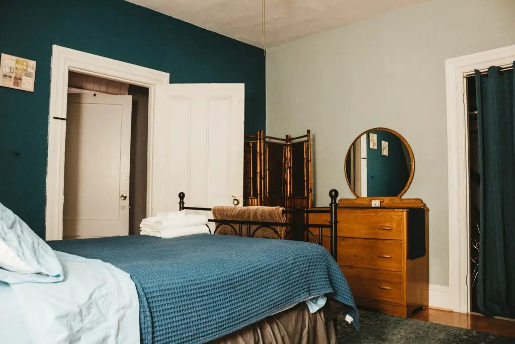 Bed Facing Door - Superstition, Feng Shui & Tips 2 white bed linen on bed