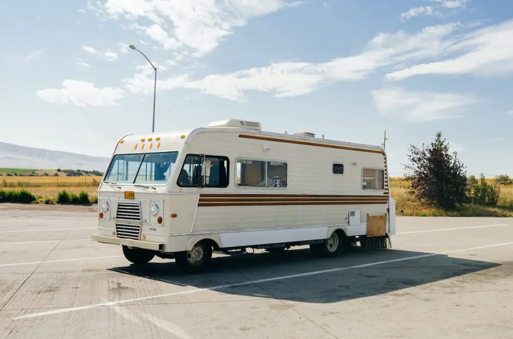 13 Safe Places To Sleep in Your Car - for Free 8 white and blue bus on road during daytime rest stop