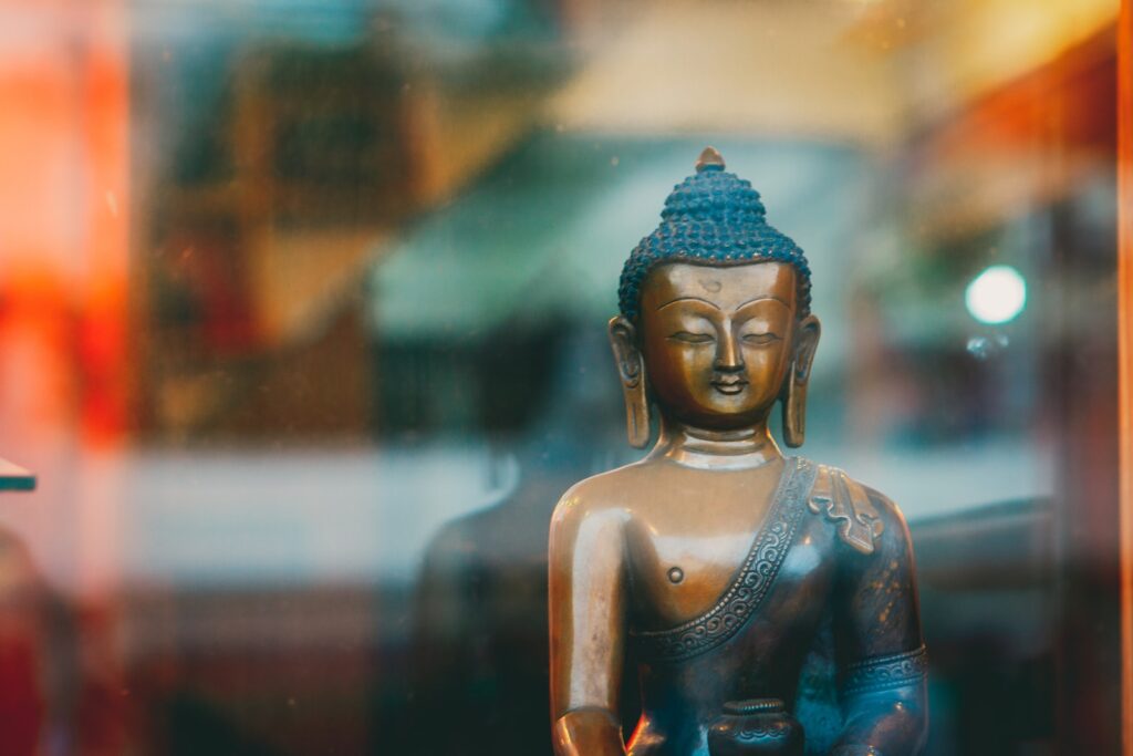 blue buddha figurine in tilt shift lens brahma muhurta time