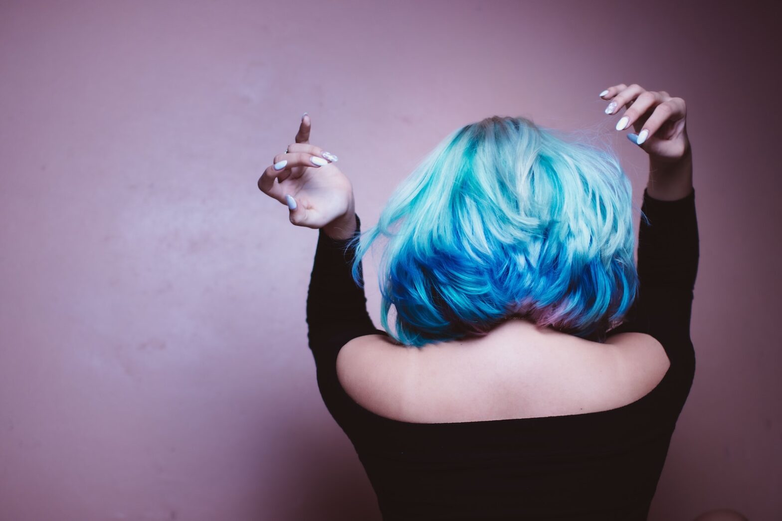 woman facing backward with blue hair. Can You Sleep with Wigs on?