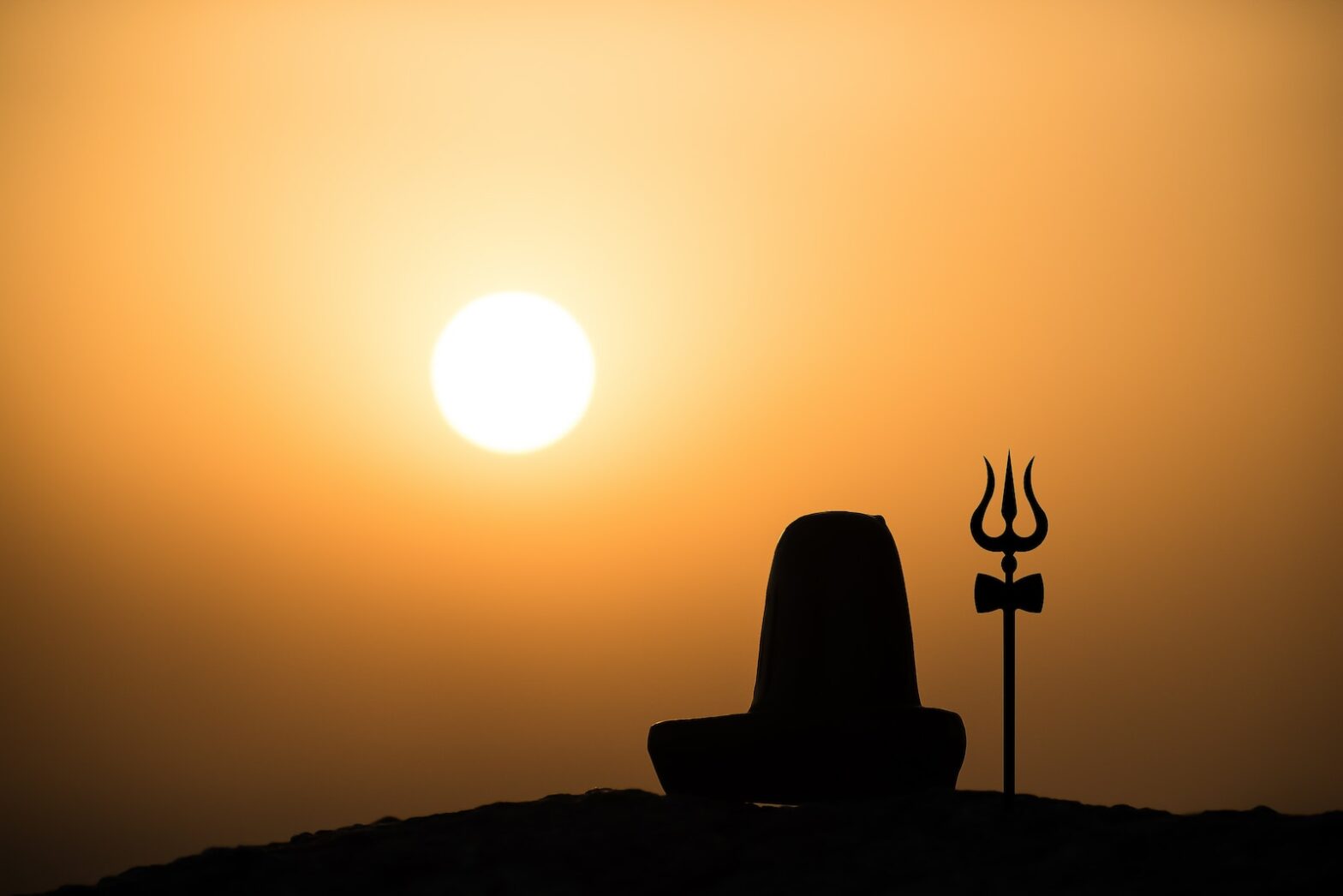 silhouette of statue during sunset brahma muhurta time